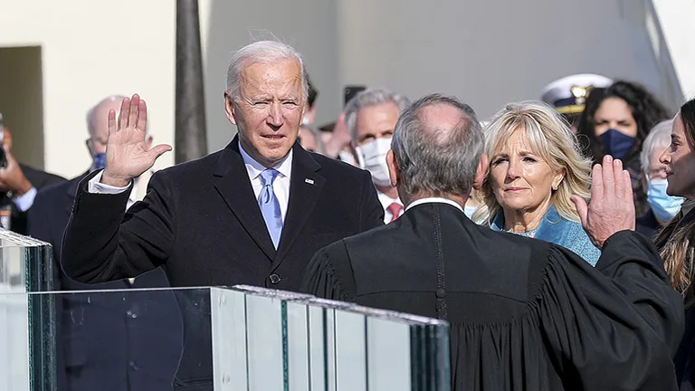 Joe Biden takes the oath of office to be sworn in as the 46th president of the US